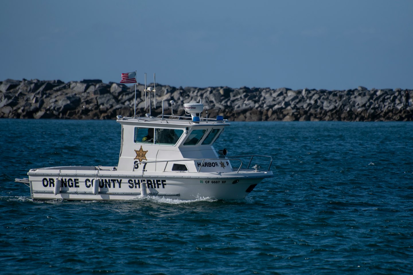 Orange County Sheriff patrol boat moves across the water.